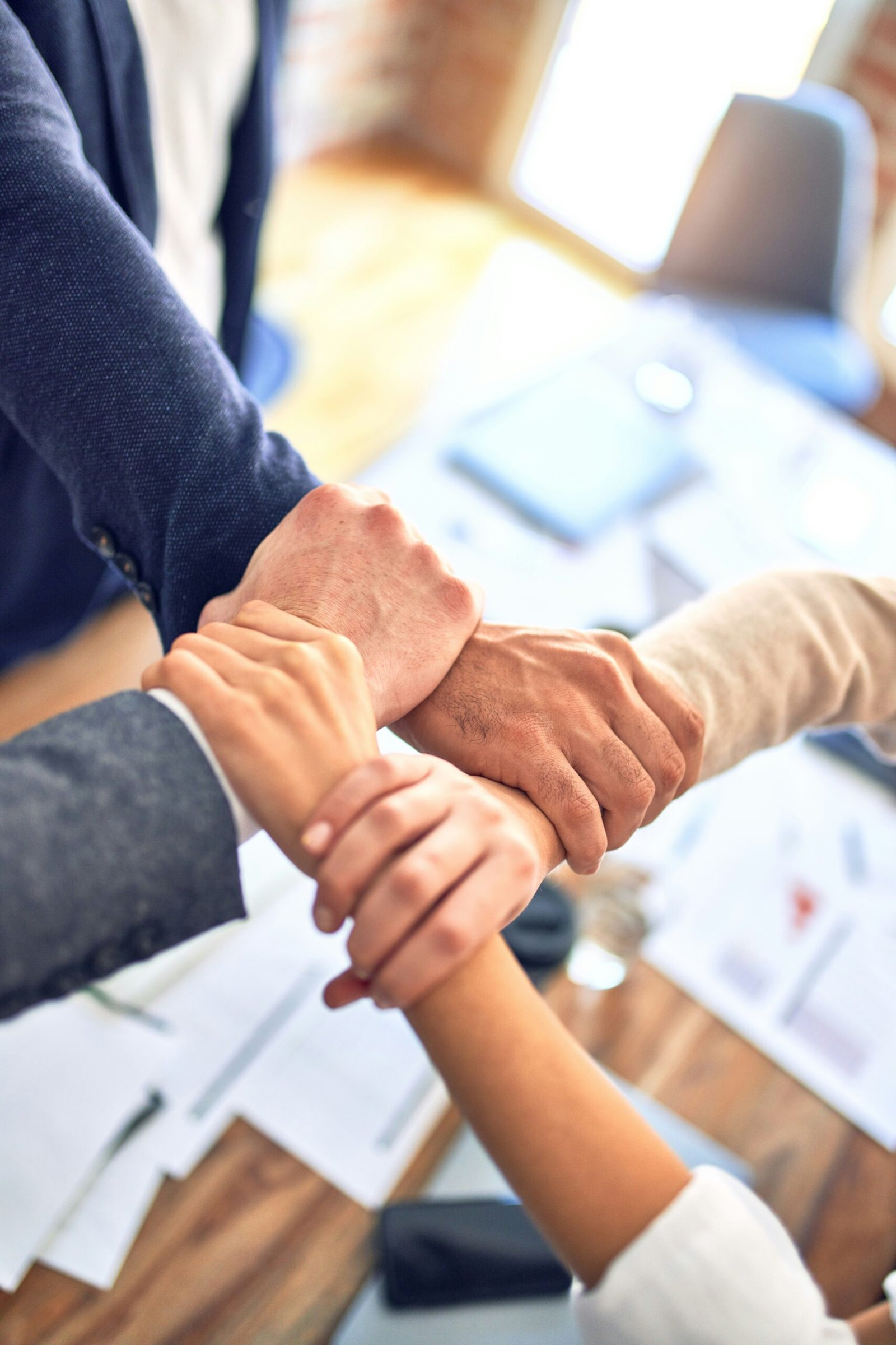 person in black long sleeve shirt holding persons hand scaled
